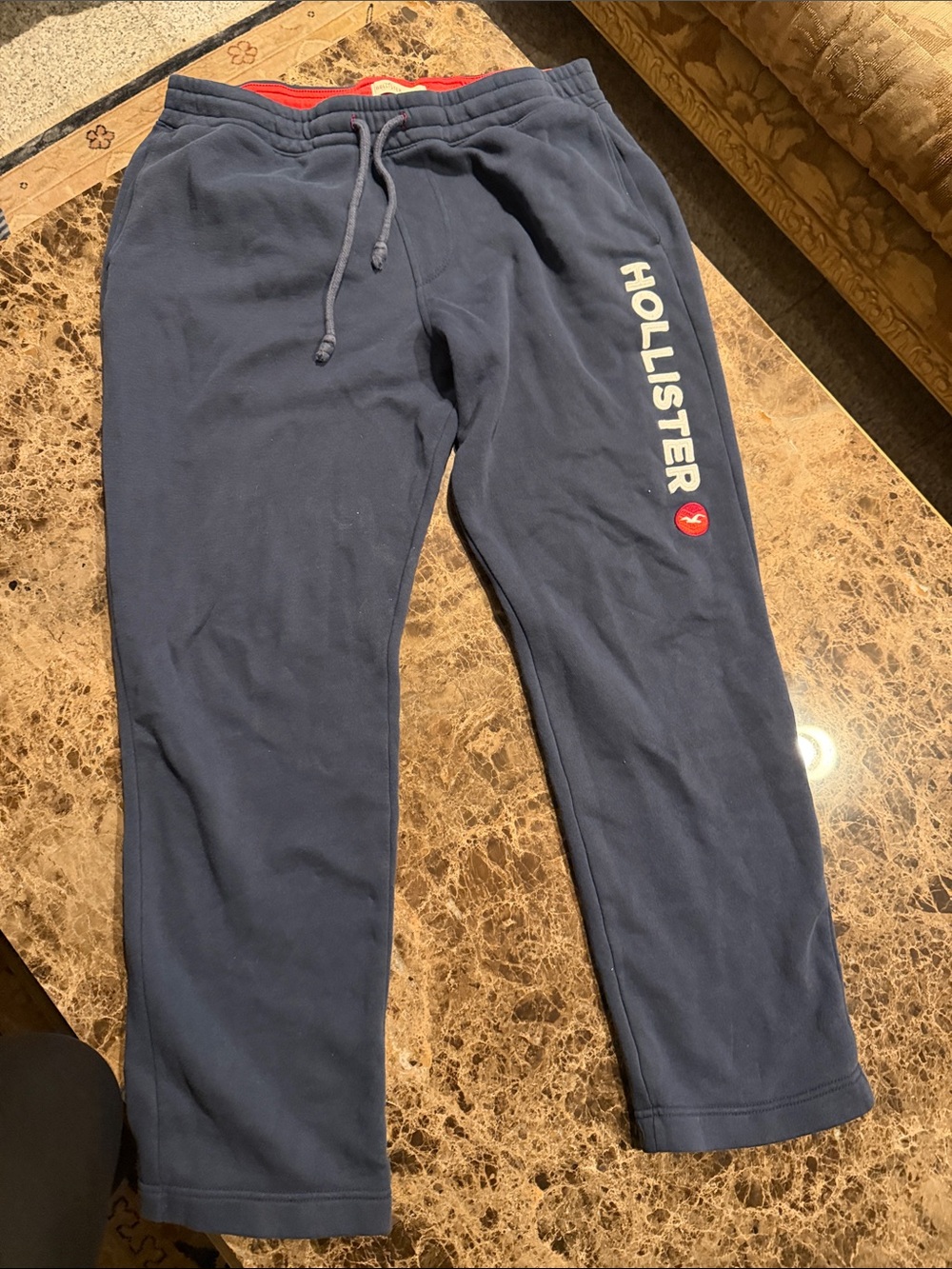 Hollister Men's Dark Blue Joggers with White Logo and Red Accent